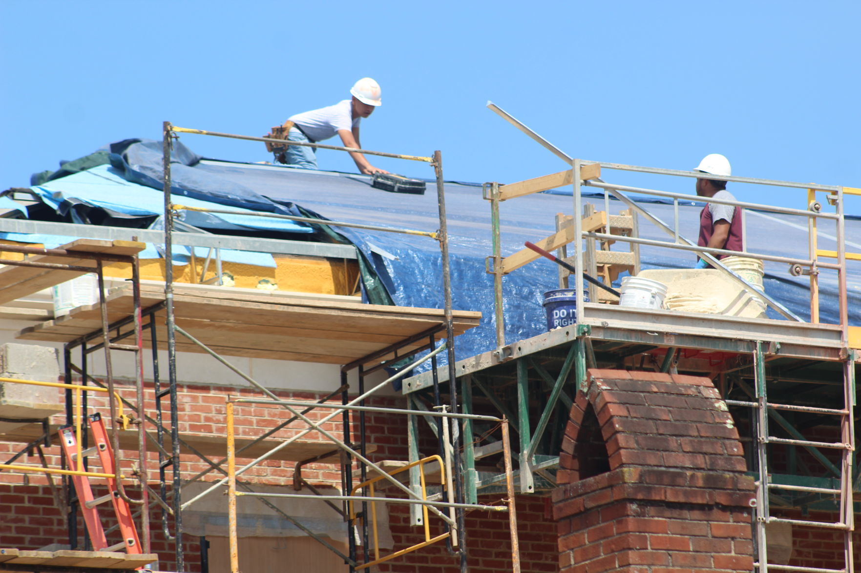 Workers on top of courthouse.JPG